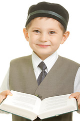 Image showing Smiling boy with open book