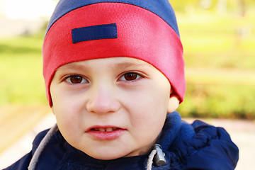 Image showing Cute boy looks to camera