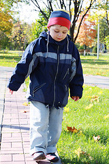 Image showing Boy walks in park