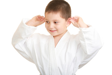 Image showing Funny karate kid touching ears