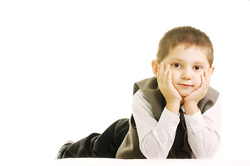 Image showing Boy laying down against white