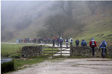 Image showing Walkers setting off on a foggy morning