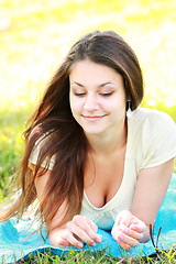 Image showing Relaxed brunette outdoors