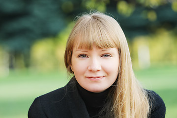 Image showing Woman in black overcoat