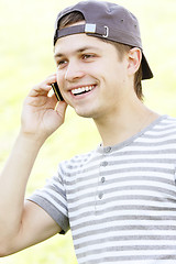 Image showing Smiling guy with phone