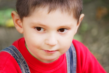 Image showing Serene kid in red