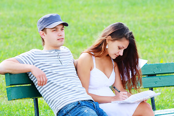 Image showing Couple sitting on bench