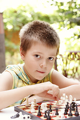 Image showing Kid playing chess