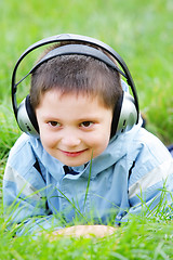 Image showing Smiling kid in headphones
