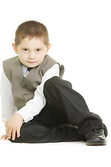 Image showing Kid sitting on white ground