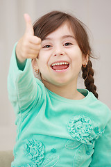 Image showing Shouting girl with thumb up