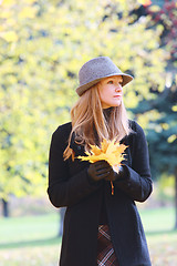 Image showing Blonde with autumn leaves