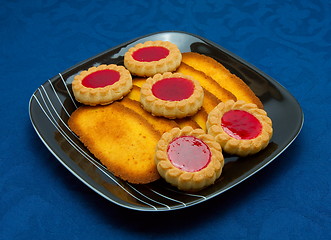 Image showing cookies on a Plate on a blue background 