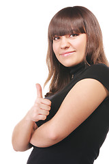 Image showing Brunette in black thumb up sideview