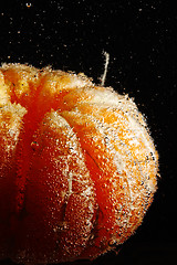 Image showing Peeled mandarine in bubbles