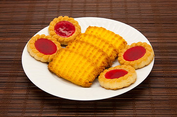 Image showing plate of cookies on dark brown background