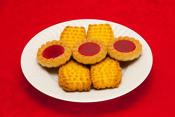 Image showing plate of cookies on red background