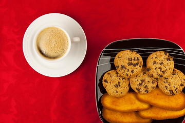 Image showing Coffee and cookies on a red background