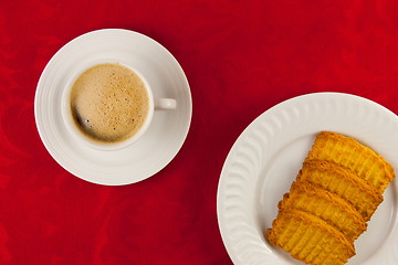 Image showing Coffee and cookies on a red background