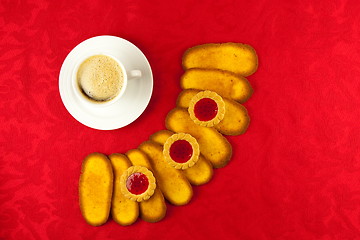 Image showing Coffee and cookies on a red background