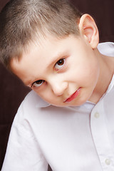 Image showing Boy in white shirt inclining right