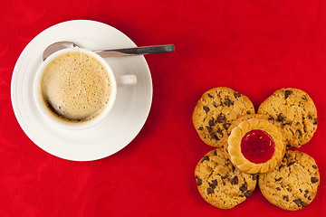 Image showing Coffee and cookies on a red background