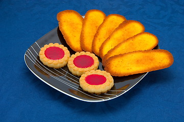 Image showing cookies on a Plate on a blue background 