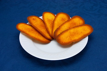 Image showing cookies on a Plate on a blue background 