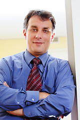 Image showing Confident businessman in blue shirt