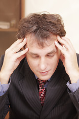 Image showing Businessman lost in thoughts