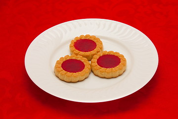 Image showing plate of cookies on red background