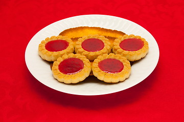 Image showing plate of cookies on red background