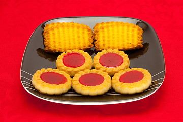 Image showing plate of cookies on red background