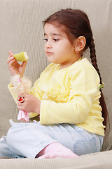 Image showing Girl with apple slice