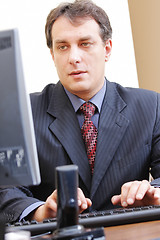 Image showing Businessman typing