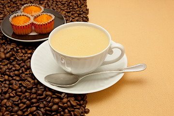 Image showing White cup of coffee and coffee beans