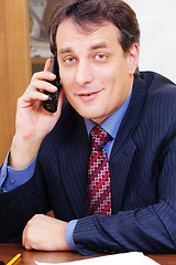 Image showing Positive businessman on phone