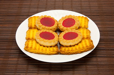 Image showing plate of cookies on dark brown background