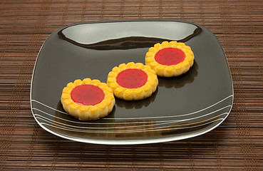 Image showing plate of cookies on dark brown background