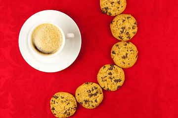 Image showing Coffee and cookies on a red background