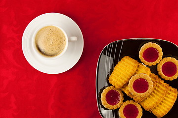 Image showing Coffee and cookies on a red background