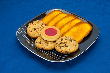 Image showing cookies on a Plate on a blue background