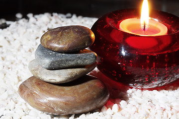 Image showing Stones and blazing candle