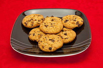 Image showing plate of cookies on red background