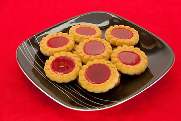 Image showing plate of cookies on red background