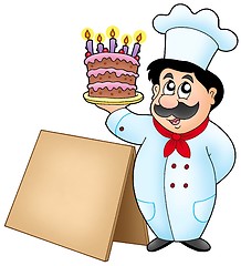 Image showing Chef holding cake with wooden table