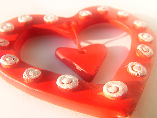 Image showing Three valentine hearts background, toned