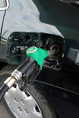 Image showing petrol pump filling car up with fuel