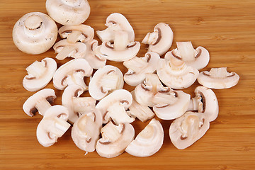 Image showing mushrooms on chopping board 