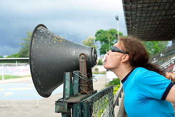Image showing Man yelling thru horn